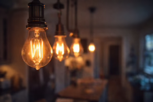Close-up of flickering Edison light bulbs inside a home with warm glowing filament