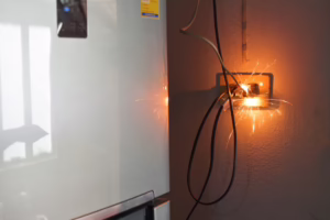 electrical plug sparking and burning Caused by a short circuit, concept, danger from using non-standard equipment, defective equipment